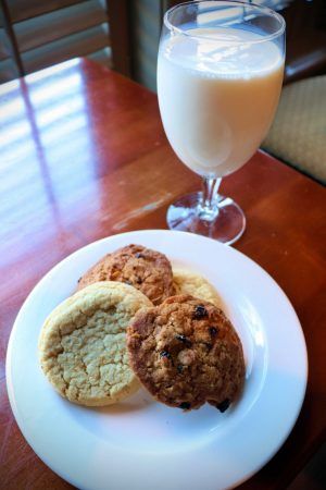 A plate of cookies and a glass of milk