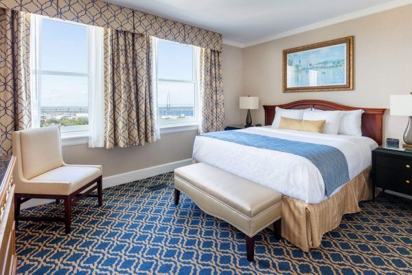 A bedroom is shown with blue and gold accents.