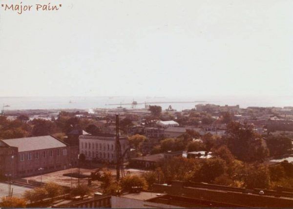 A photo from the 1980s shows the Charleston skyline with the harbor in the background.