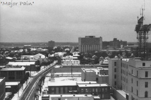 A black and white photo from the roof of the hotel shows the Charleston city under a snowfall in 1979.