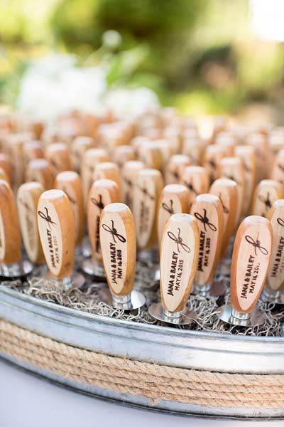 Oyster knives in a basket with names engraved on handle.