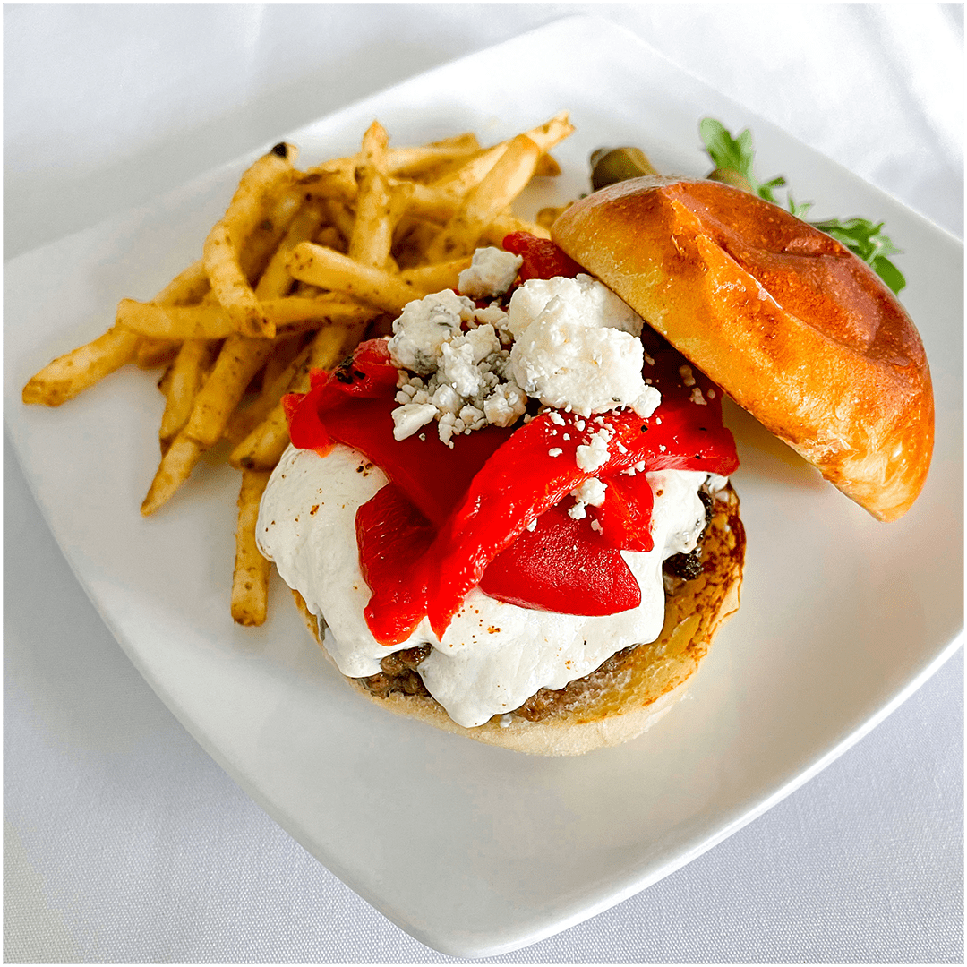 size for sf menu wpress A burger with sautéed mushrooms and a white cheese. Yellow crispy fries sit next to the burger and green okra and pickles garnish the plate.